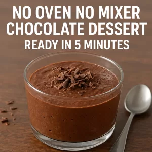 No-oven no-mixer chocolate dessert in a glass jar with chocolate shavings and a spoon, ready in 5 minutes.